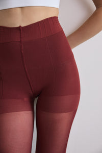 Close-up view of the Contour Shaping Panty on the Classic Over-the-Knee Tights in Zinfandel, showing the high-rise waistband at the natural waist with ribbed sculpting effect