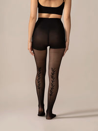 Back full view of the legs in the Back Vine Sheer Tights in Black, showing the vine detail from behind.